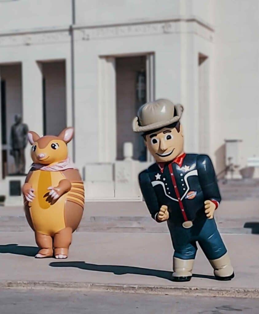 big tex and armadillo at the fair