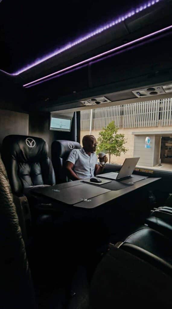 business passenger working on the vonlane bus from austin to dallas