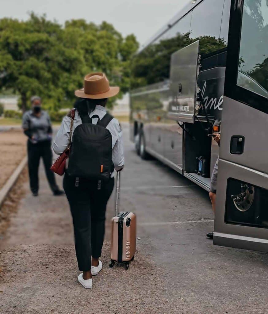 a passenger checking in and pre-boarding a Vonlane bus