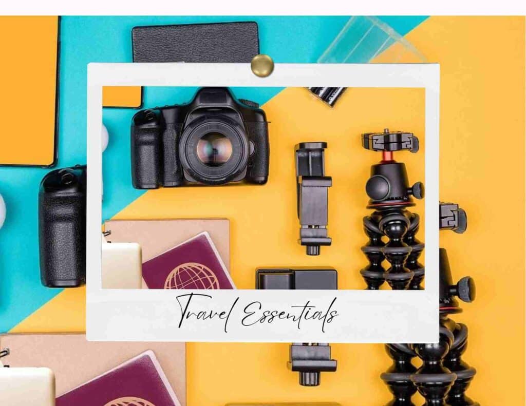 Flat lay of travel gear including camera passport and travel accessories representing essential travel tools
