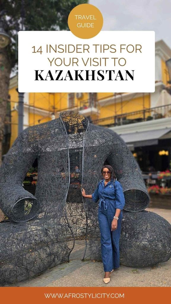 Almaty, Kazakhstan travel tips featuring a woman beside a large bear sculpture in Almaty.